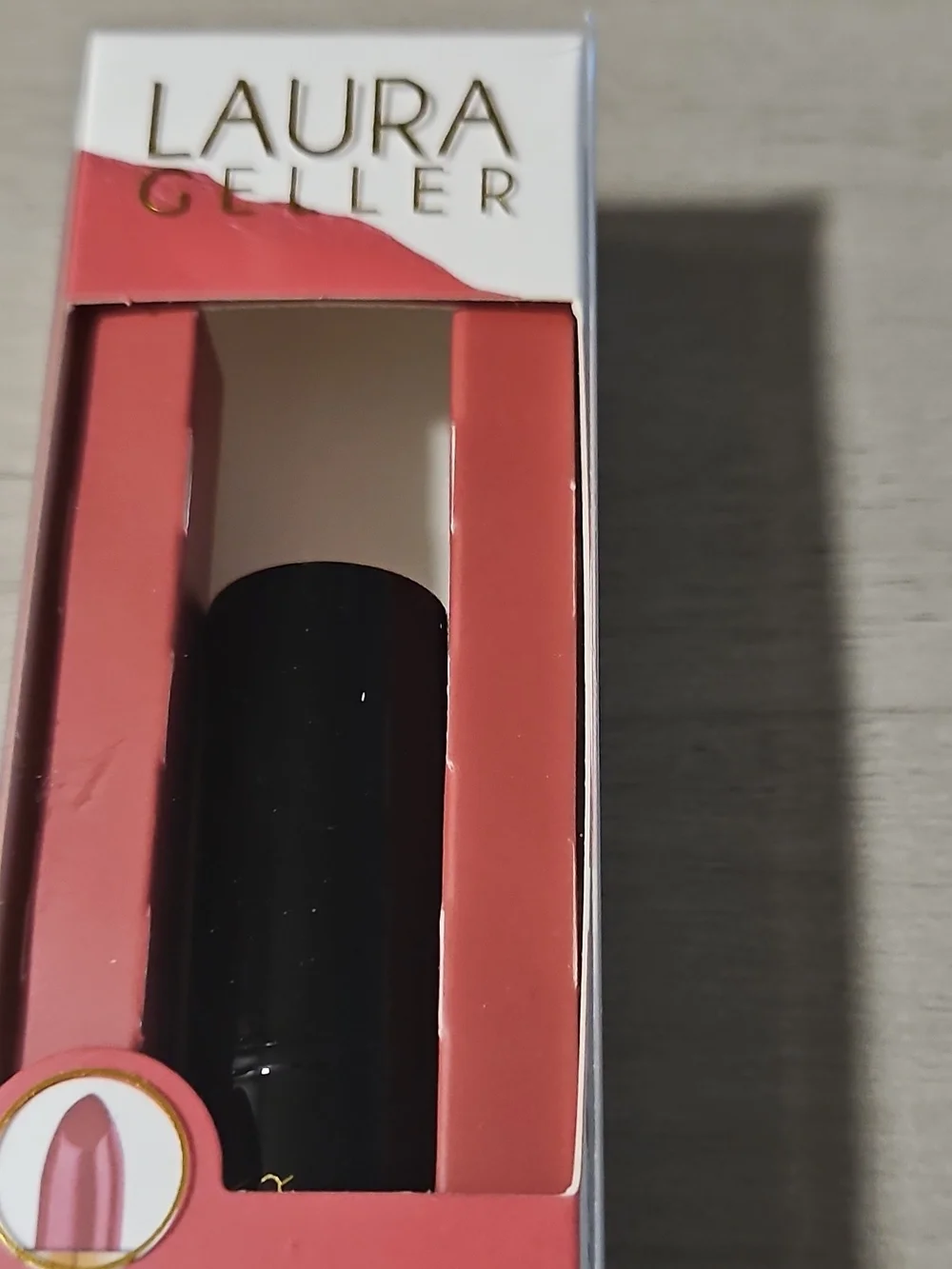 Laura Geller Coral Lipstick with Black Tube